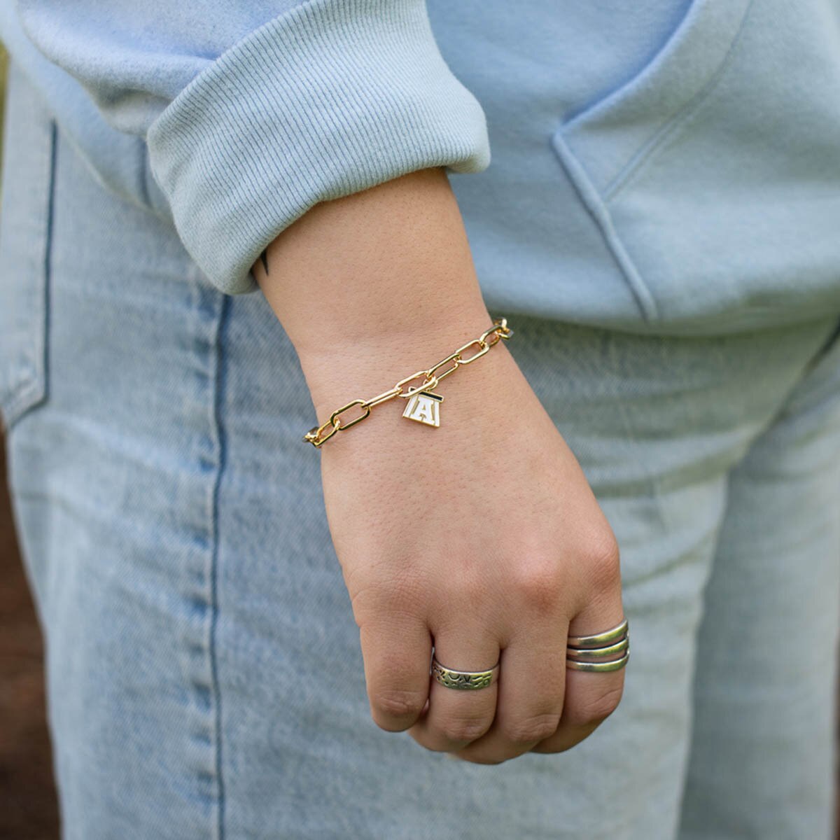 Block A Charm Bracelet Gold worn on wrist